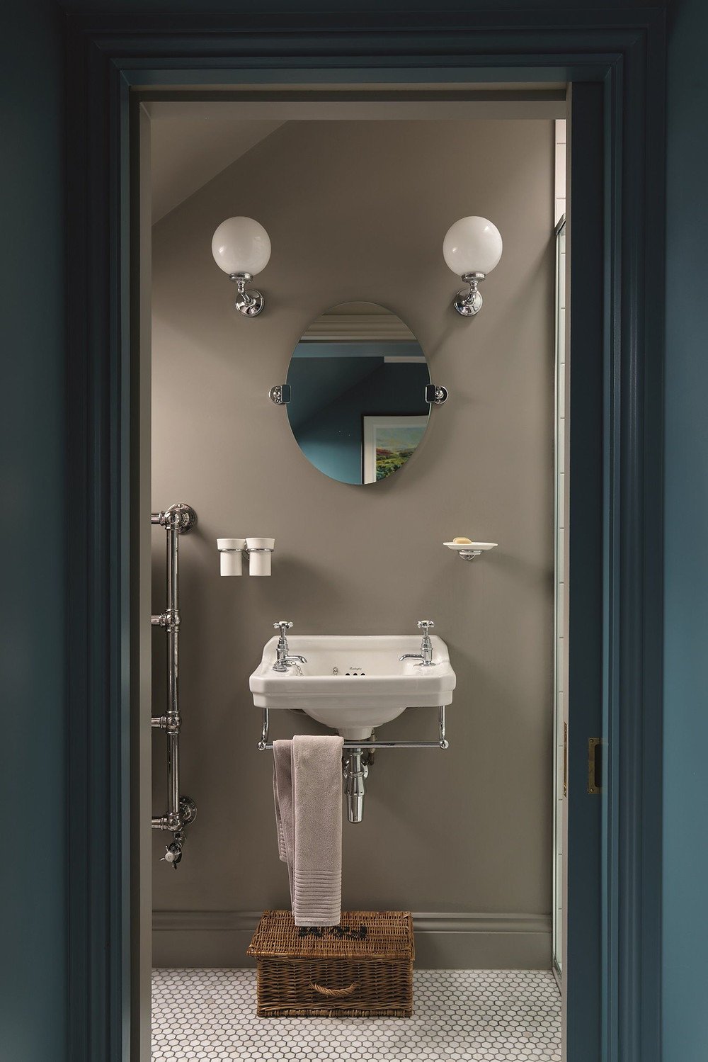 a bathroom painted in WORSTED by Farrow & Ball with penny mosaic floor