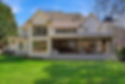View of backyard with accordian doors open to patio.jpg