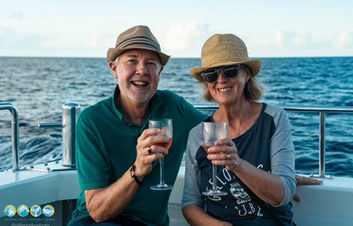 guests with champagne on our Sunset Whale Watch Cruise