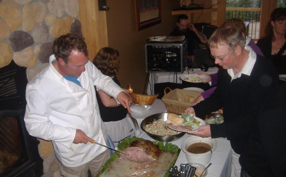 chef dishing out food at wedding buffet
