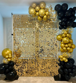 Gold Shimmer Wall with Balloon Arch