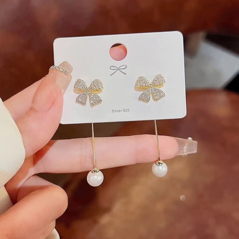 Thumbnail: Elegant Gold Bow Pearl Dangle Korean Earrings – Stylish Long Drop Earring