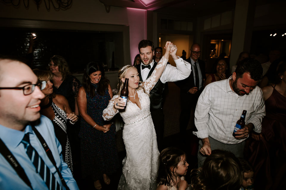 Suwanee wedding couple celebrating with guests on the dance floor