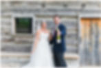 Bride and groom open a Champagne bottle at the Manor at Breckenridge wedding venue in Virginia