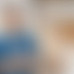 a young man smiling at an office 