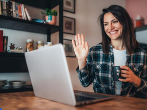 a woman having an online call with her doctor abroad