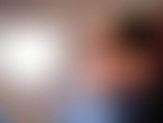 a woman with a travel pillow sitting on an airplane