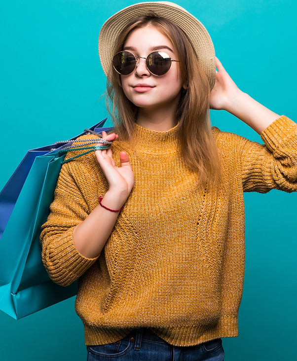 young-teen-woman-sunglasses-hat-holding-