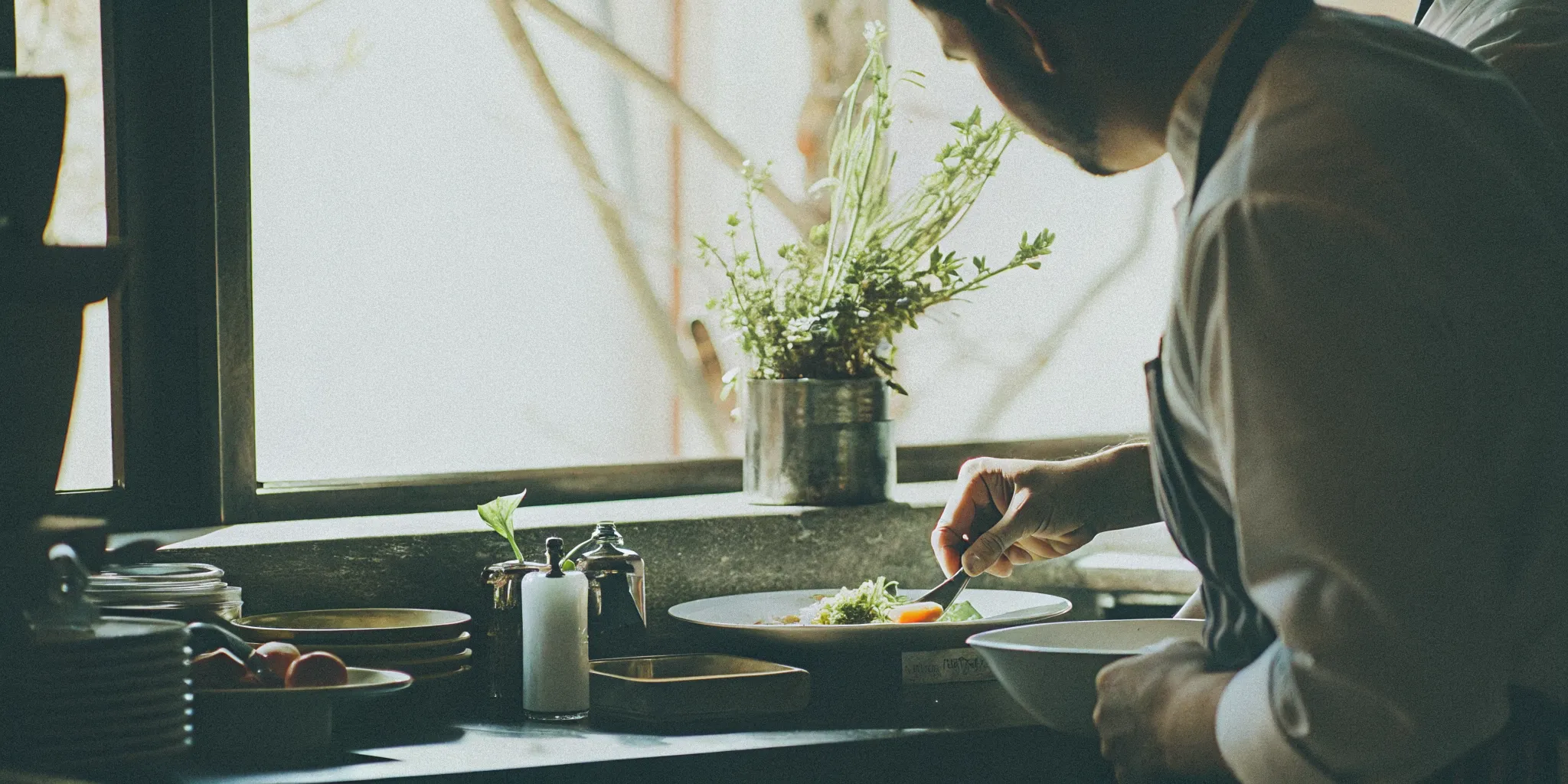 Chef at a Gather by Oren kitchen plating a seasonal dish for a San Diego Bat Mitzvah celebration