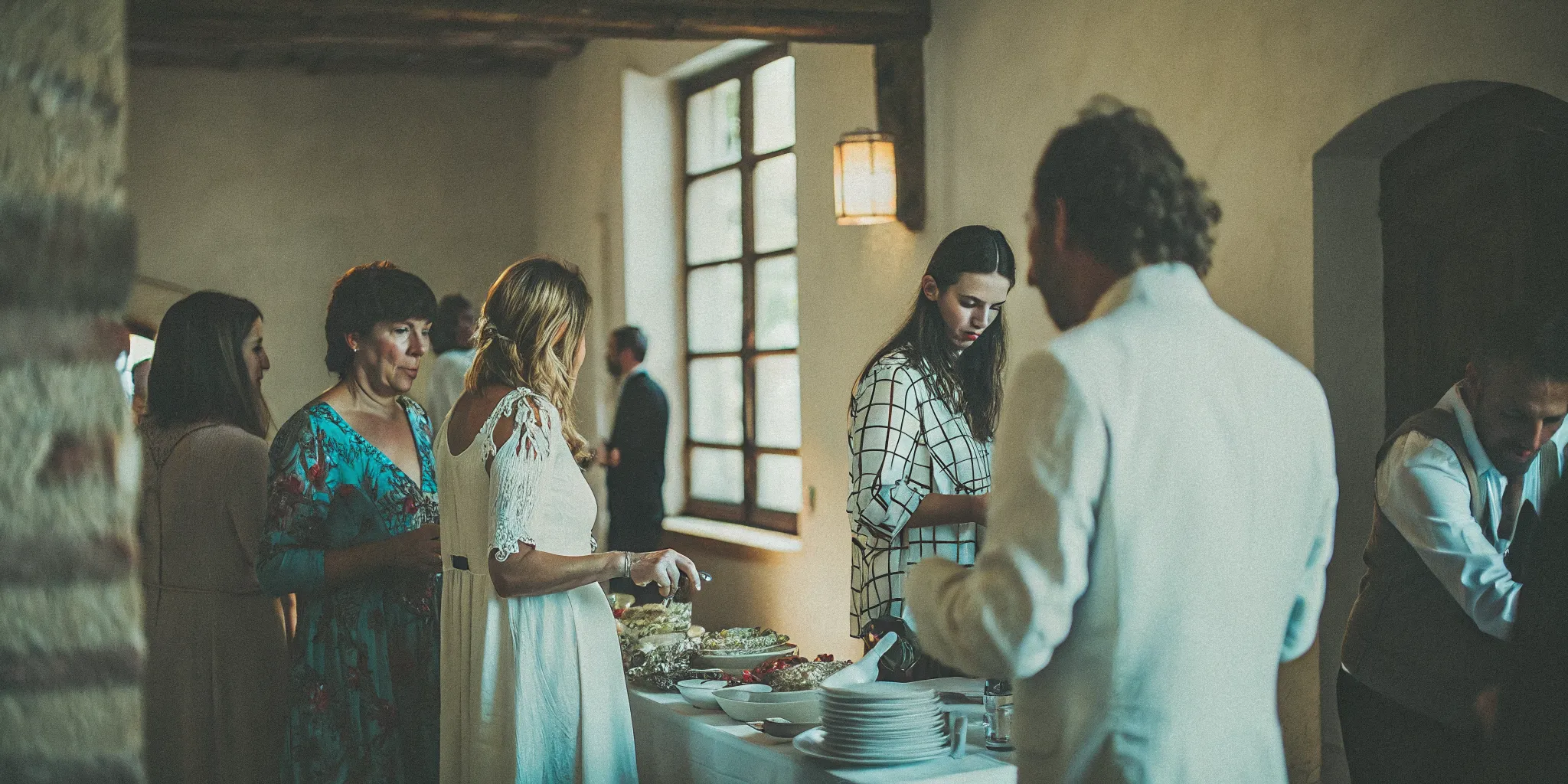 Shared Mediterranean dining platters on a family-style wedding table