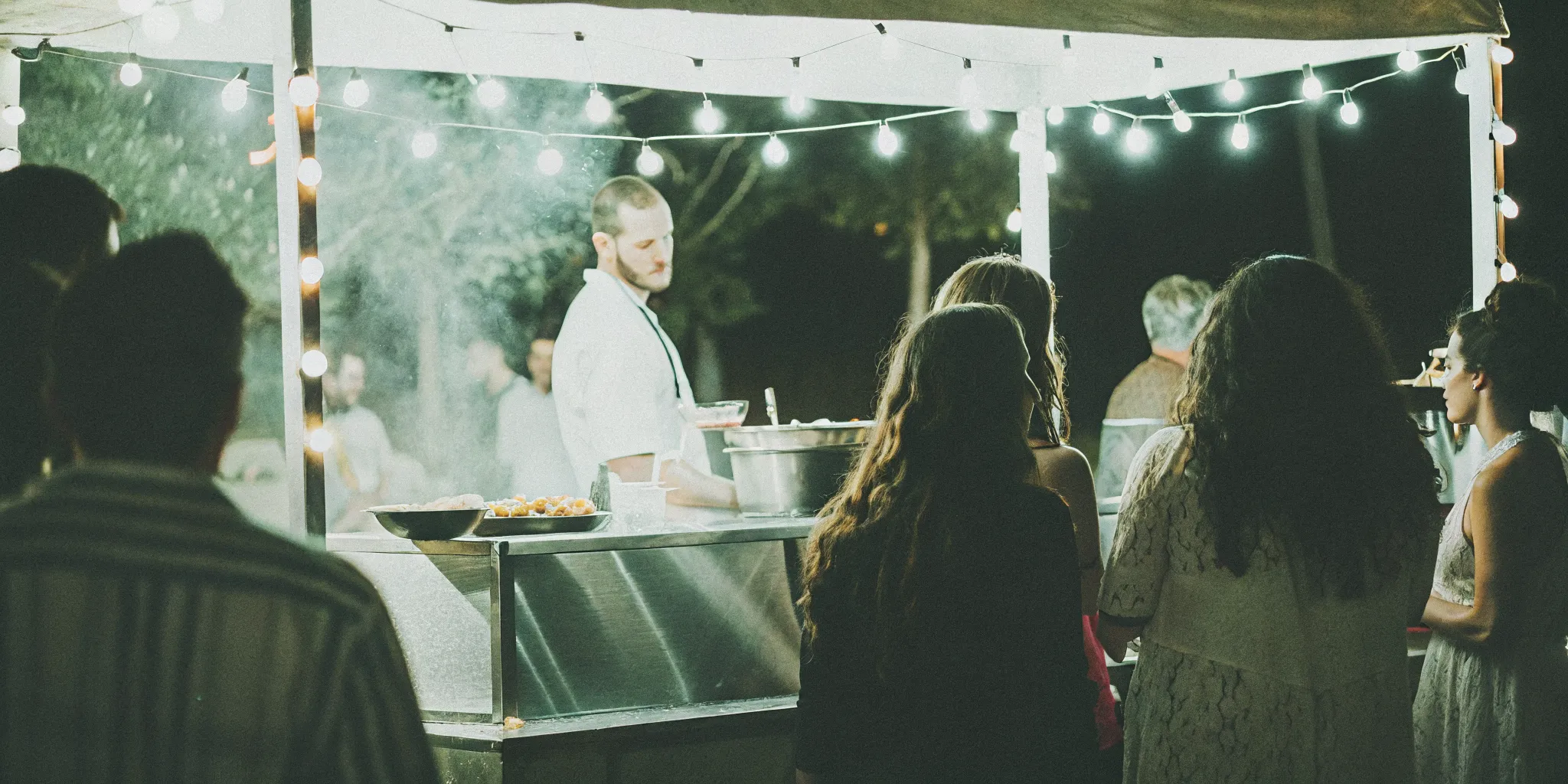 Interactive food station at a San Diego Bar Mitzvah with chef preparing Mediterranean cuisine