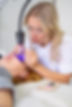 Eyelash extension procedure using ultraviolet lamp in modern beauty salon Innovative lash