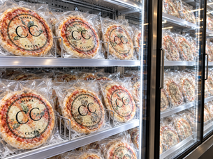 Chiara Cucina CPG frozen pizzas in a retail display freezer
