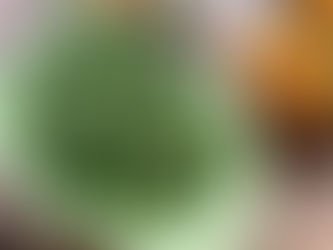 A glistening dish of green beans tossed in melted butter and fragrant garlic and shallot