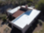 Well-maintained white roof on a house in Tucson AZ.
