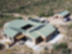 House with green metal roofing and solar panels in Tucson AZ