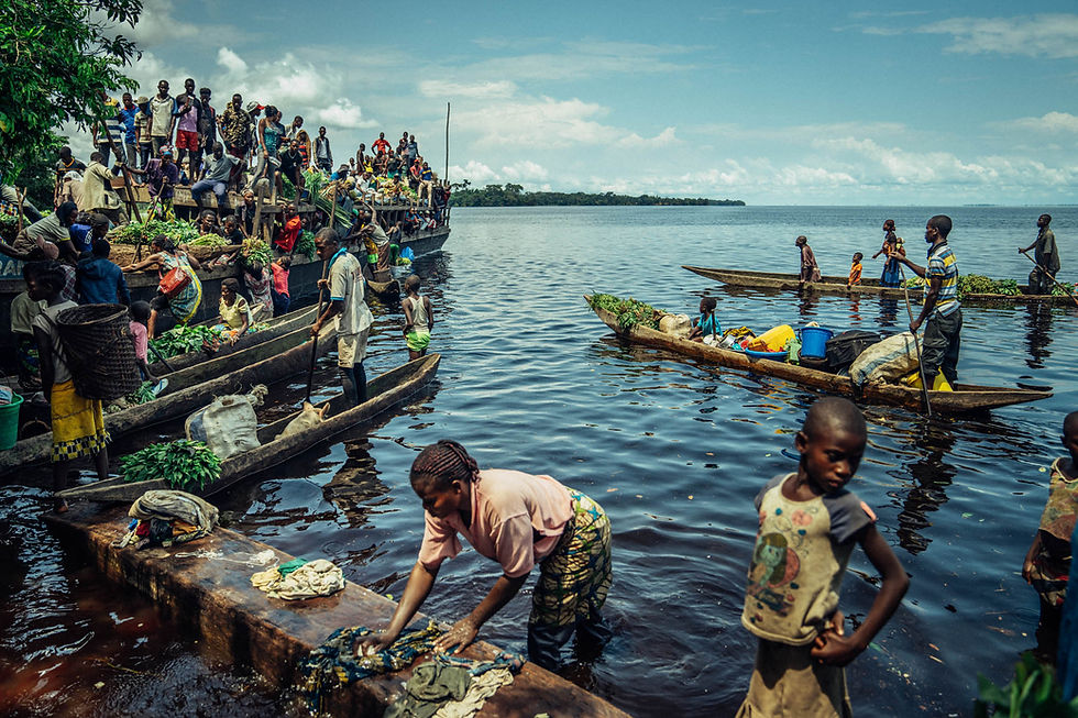 people on wooden canoes sell crops