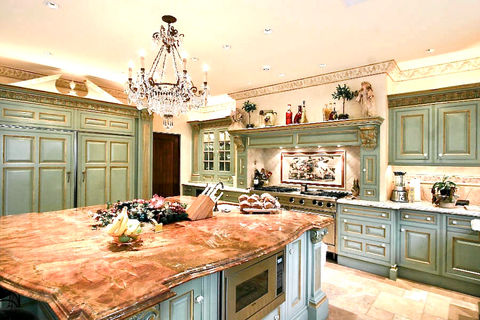 Hand painted Clive Christian kitchen cabinetry with gold leaf details