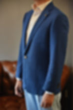 Textured blue blazer with structured fit and lapel detail, elegant modern menswear tailoring
