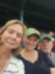 Amy Cathy and Tom sitting in Fenway Park 2023