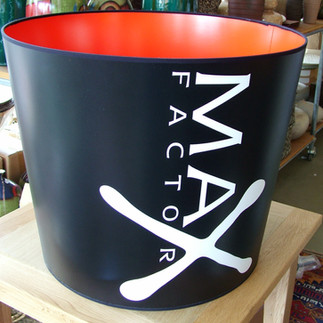 Brand Logo on a Large Lampshade Black and orange with white Text