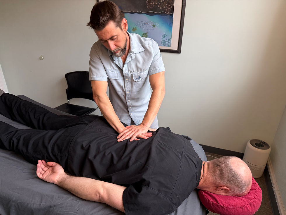Tom using Tui Na to decompress lumbar vertebrae