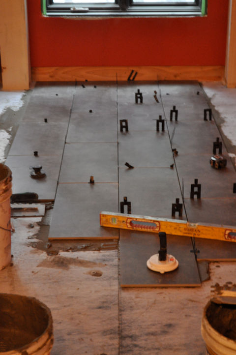 Porcelain floor tile installation, level install over radiant floor heat, anti fracture membrane, kerdi membrane, stabila level.