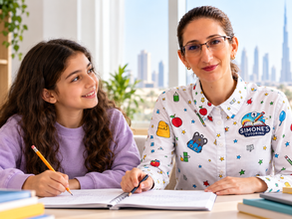 Simone and a student reviewing schoolwork together during a tutoring session.