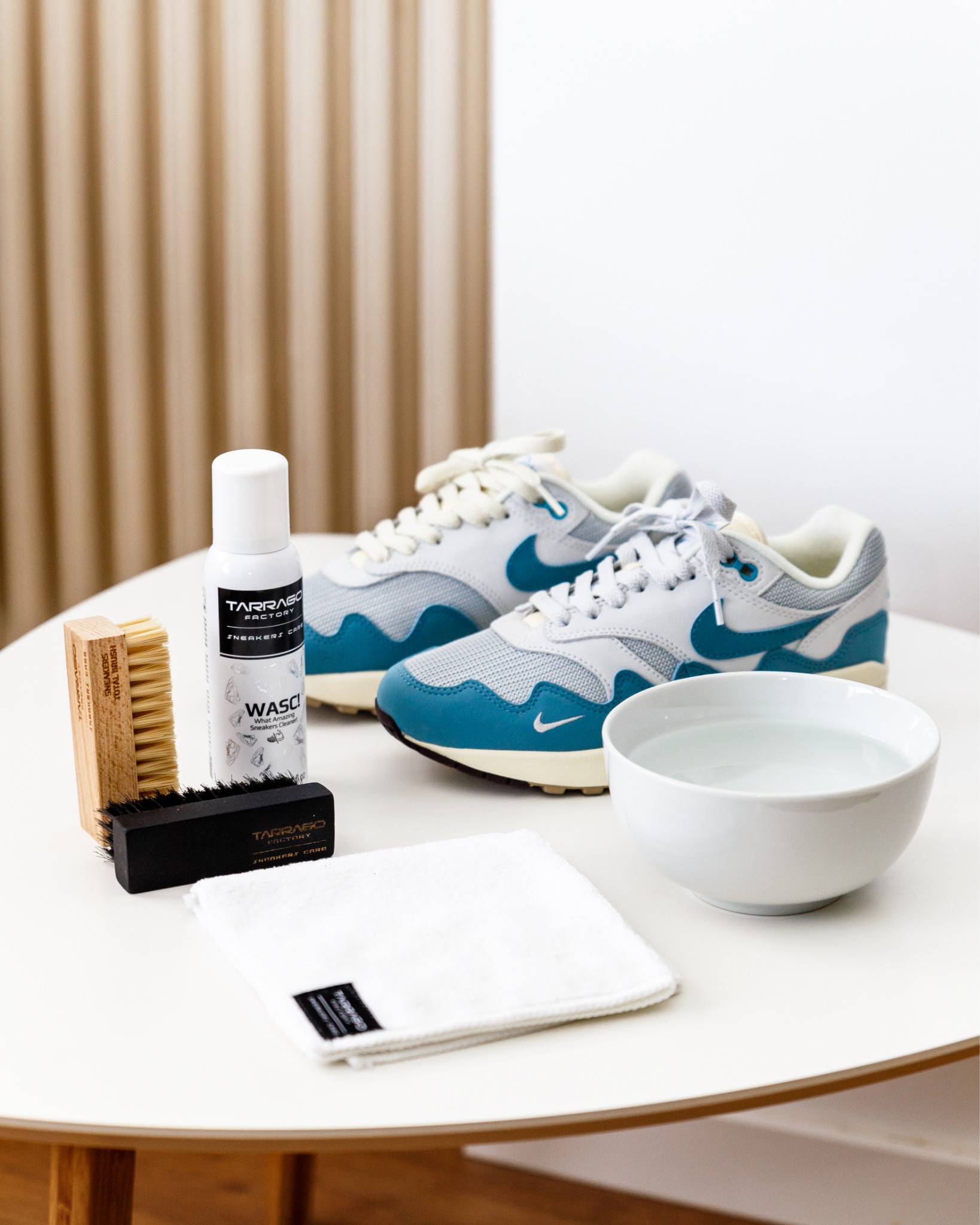Tarrago WASC sneaker cleaner and brushes alongside blue and white sneakers