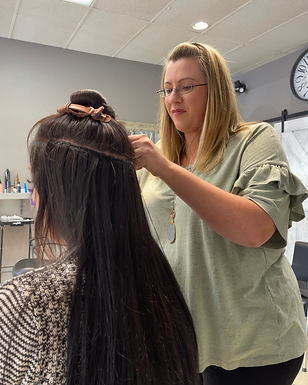Kasey installing hair extensions