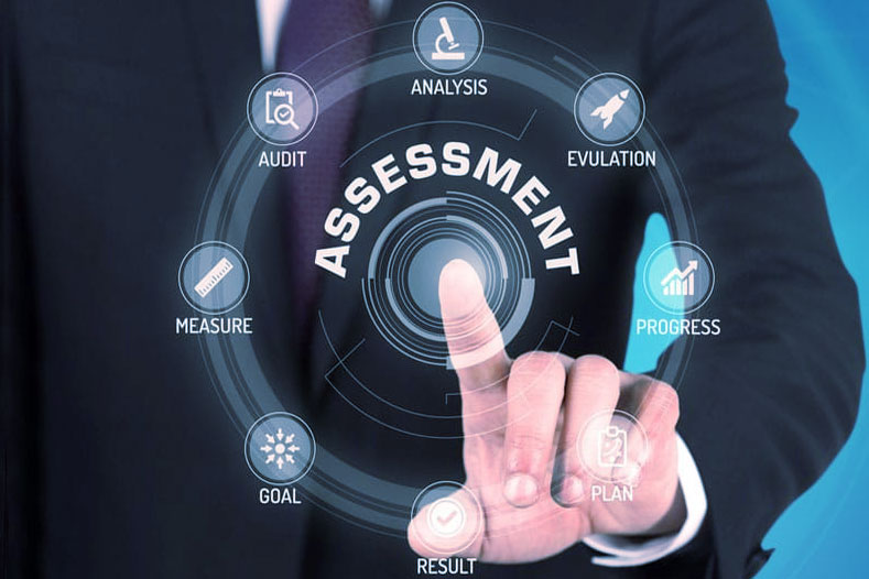 A person in a suit touches a virtual interface displaying "ASSESSMENT" surrounded by icons like Analysis, Audit, Goal, on a blue background.