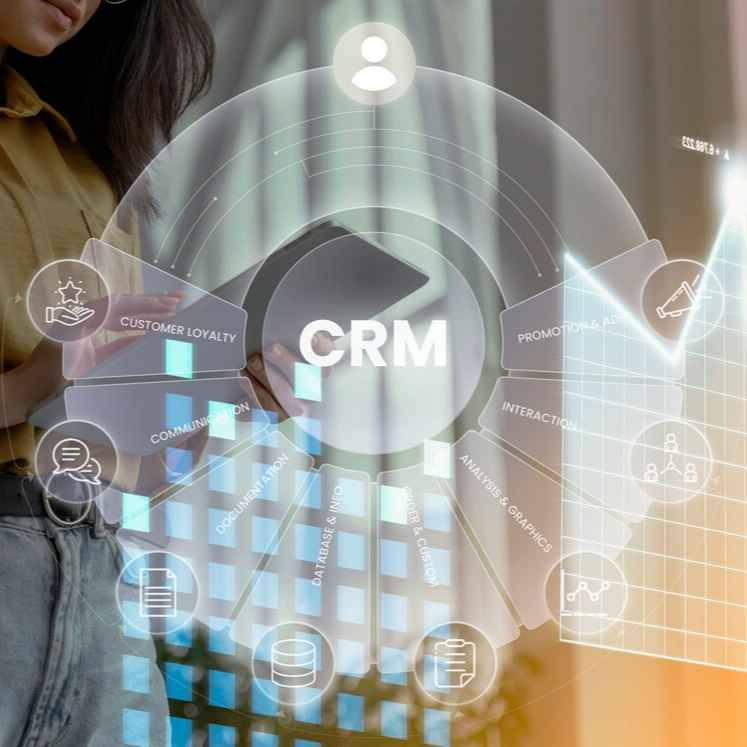 Person using tablet with overlay of CRM infographics. Includes terms like "Customer Loyalty" and "Interactions." Bright and tech-focused.