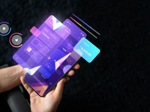 Hands holding a smartphone displaying holographic financial data, with a balance of $8,200.85. Dark background, futuristic theme.
