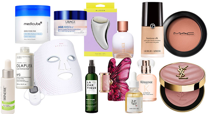 Produtos de beleza variados, incluindo cremes e maquiagens, organizados sobre fundo branco. Destacam-se embalagens coloridas e logotipos.