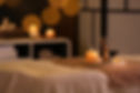 Burning candles and aromatic reed freshener on table in spa salon, space for text.jpg