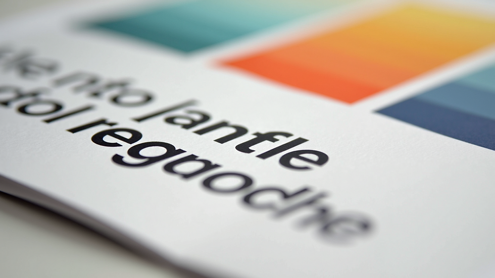 Close-up view of a brand style guide with colours and fonts