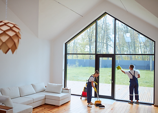 Professional cleaners washing windows inside a residential Vancouver home