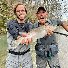 Galen and a client holding a large rainbow trout caught on a guided fly fishing trip with Shenandoah Valley Adventure Co.