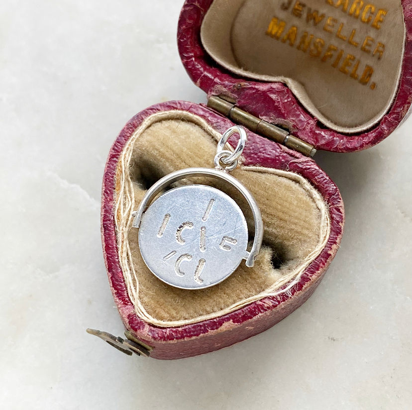 Vintage sterling silver 'I LOVE YOU' secret message spinner charm