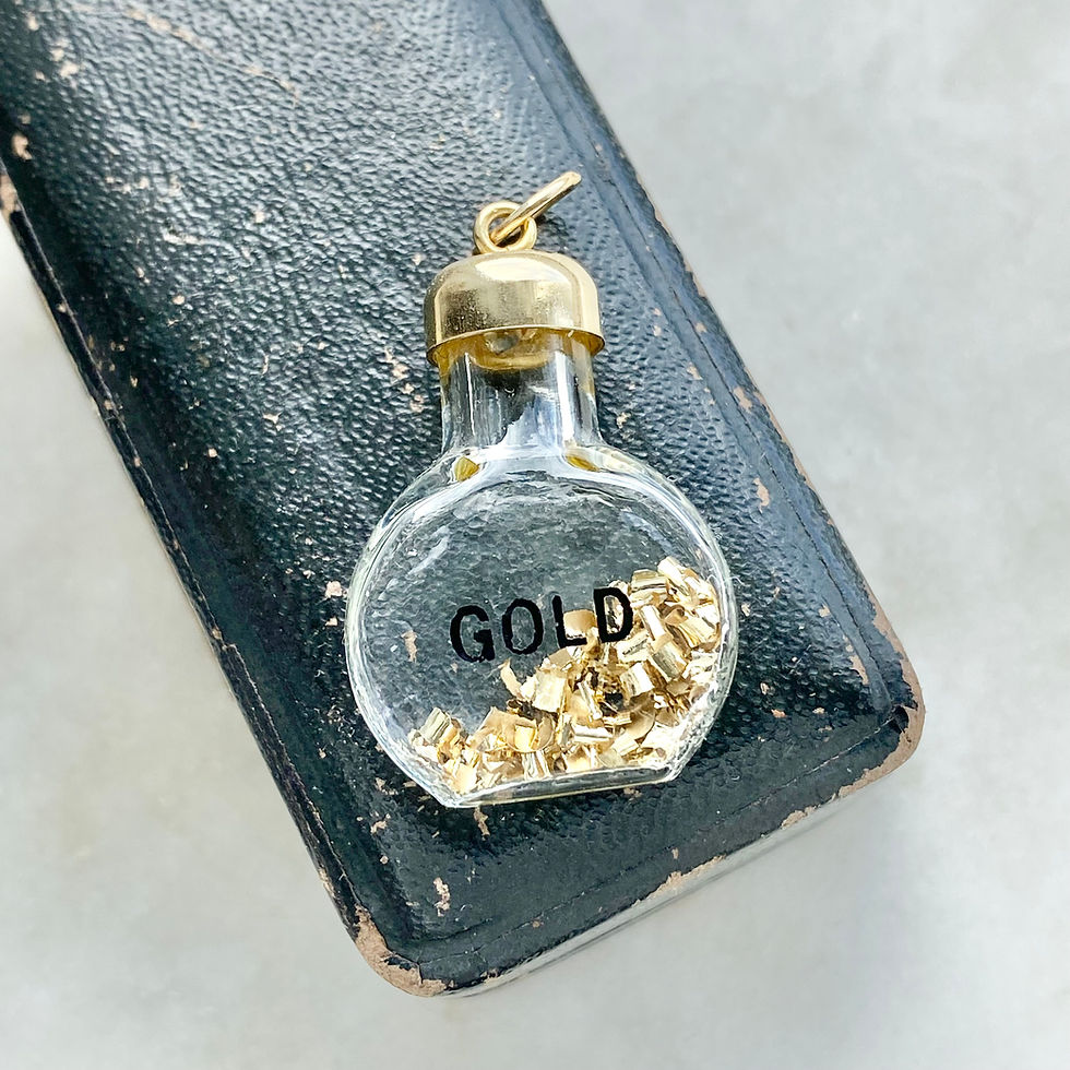 Thumbnail: Vintage 9ct gold and glass bottle/vial of gold shavings charm