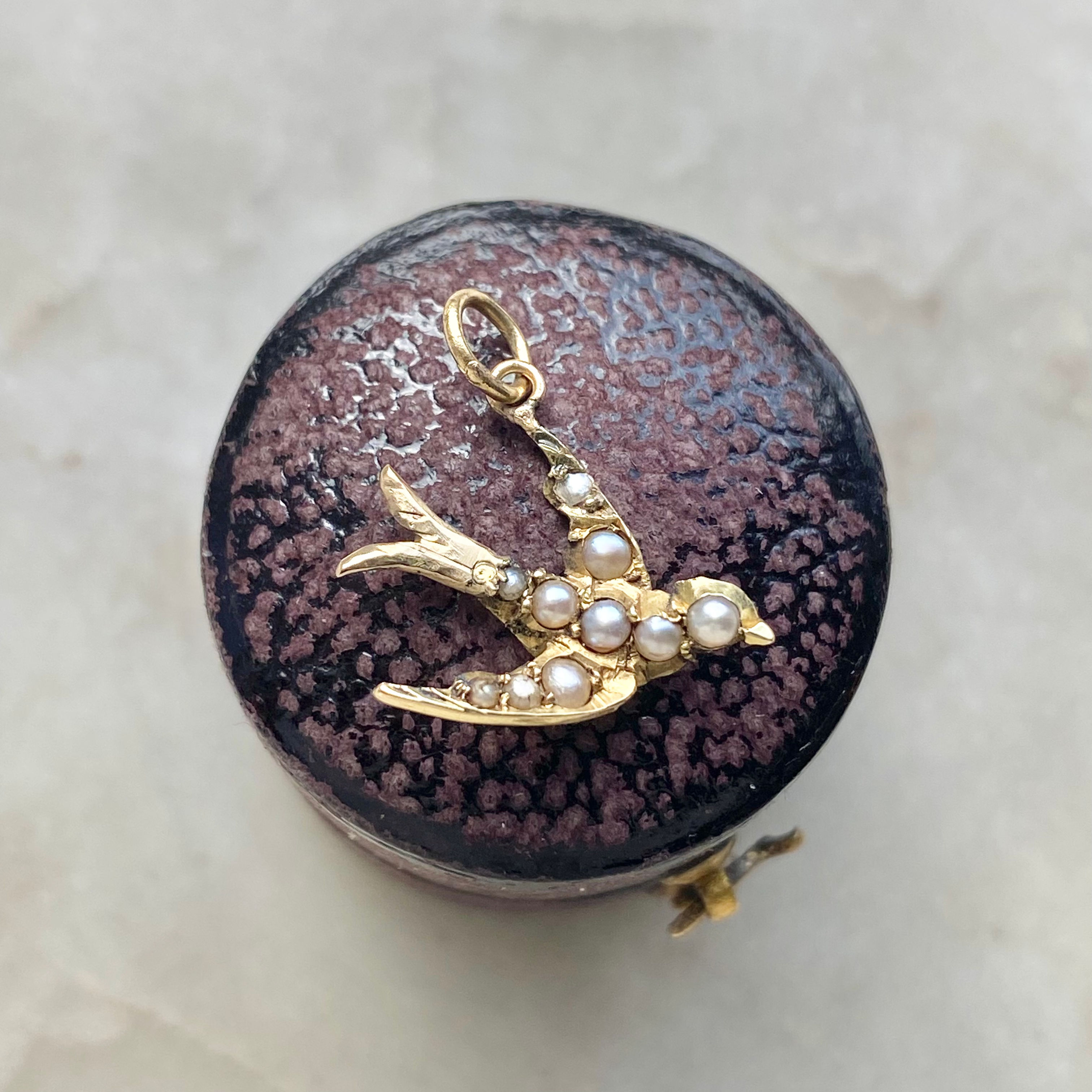 Vintage gold and seed pearl swallow charm
