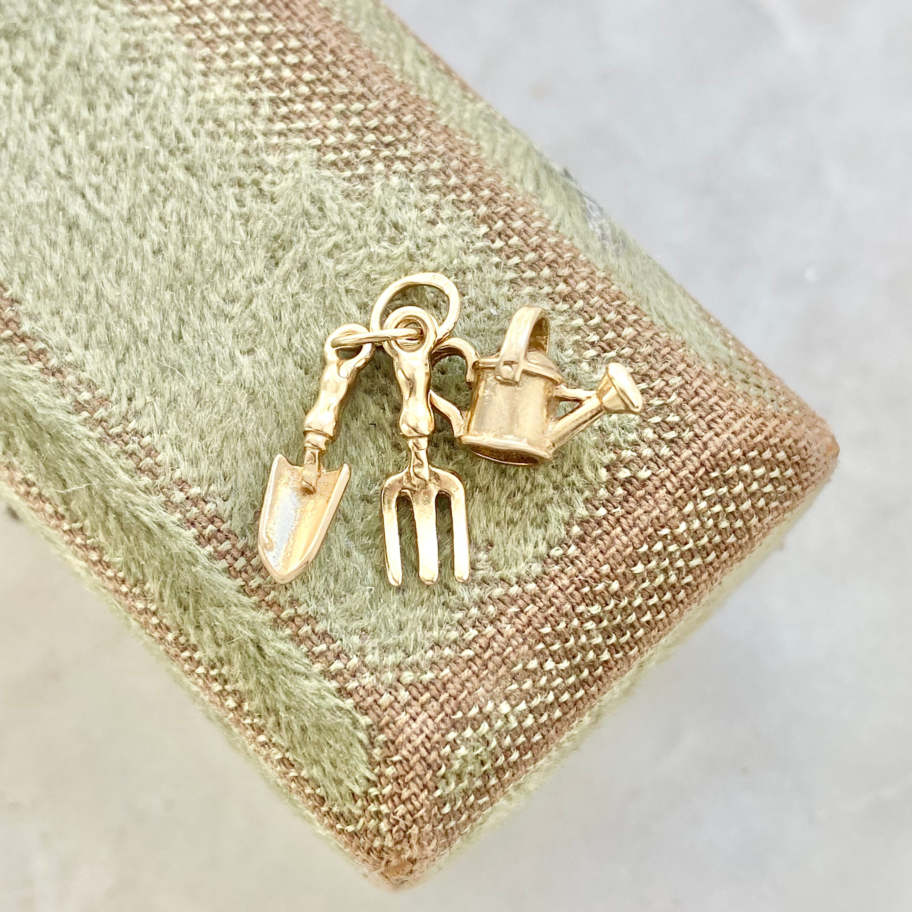 Vintage 9ct gold trio of gardening tools charm - watering can, fork and trowel