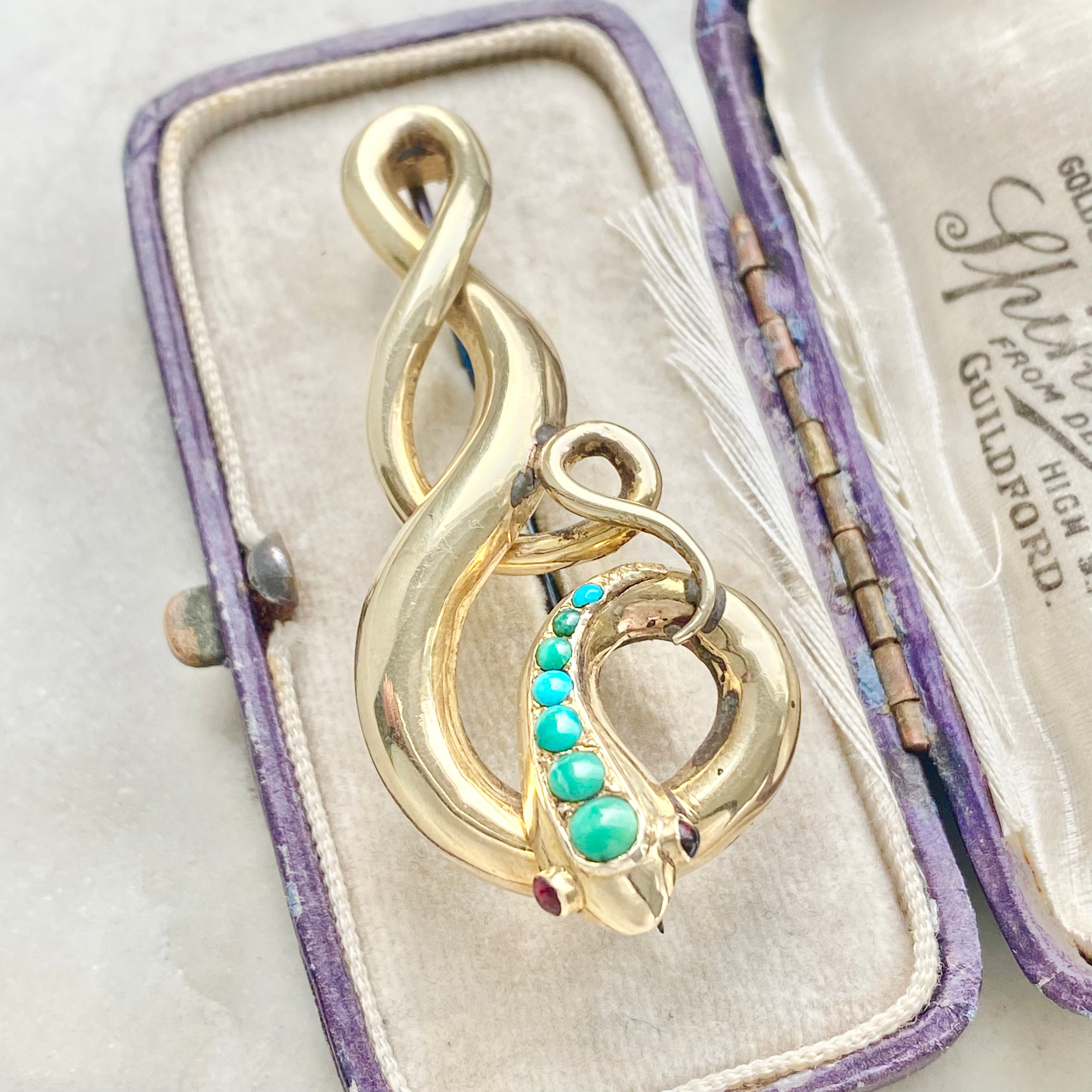 Antique turquoise and garnet snake brooch