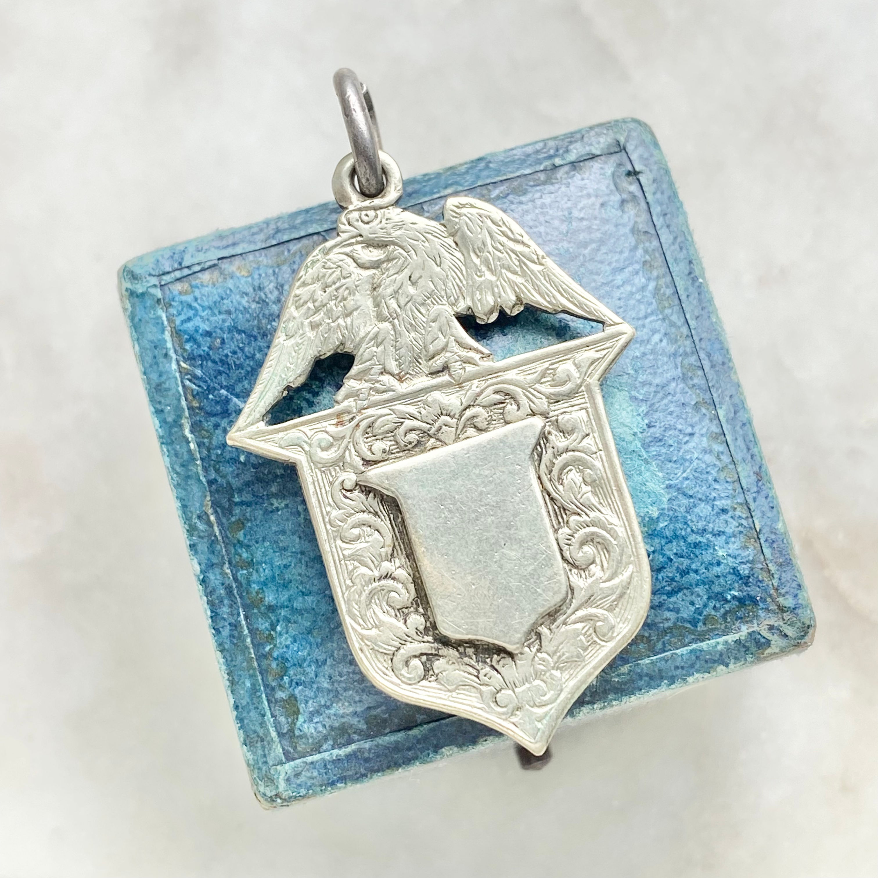 Vintage silver coloured metal eagle/bird fob pendant