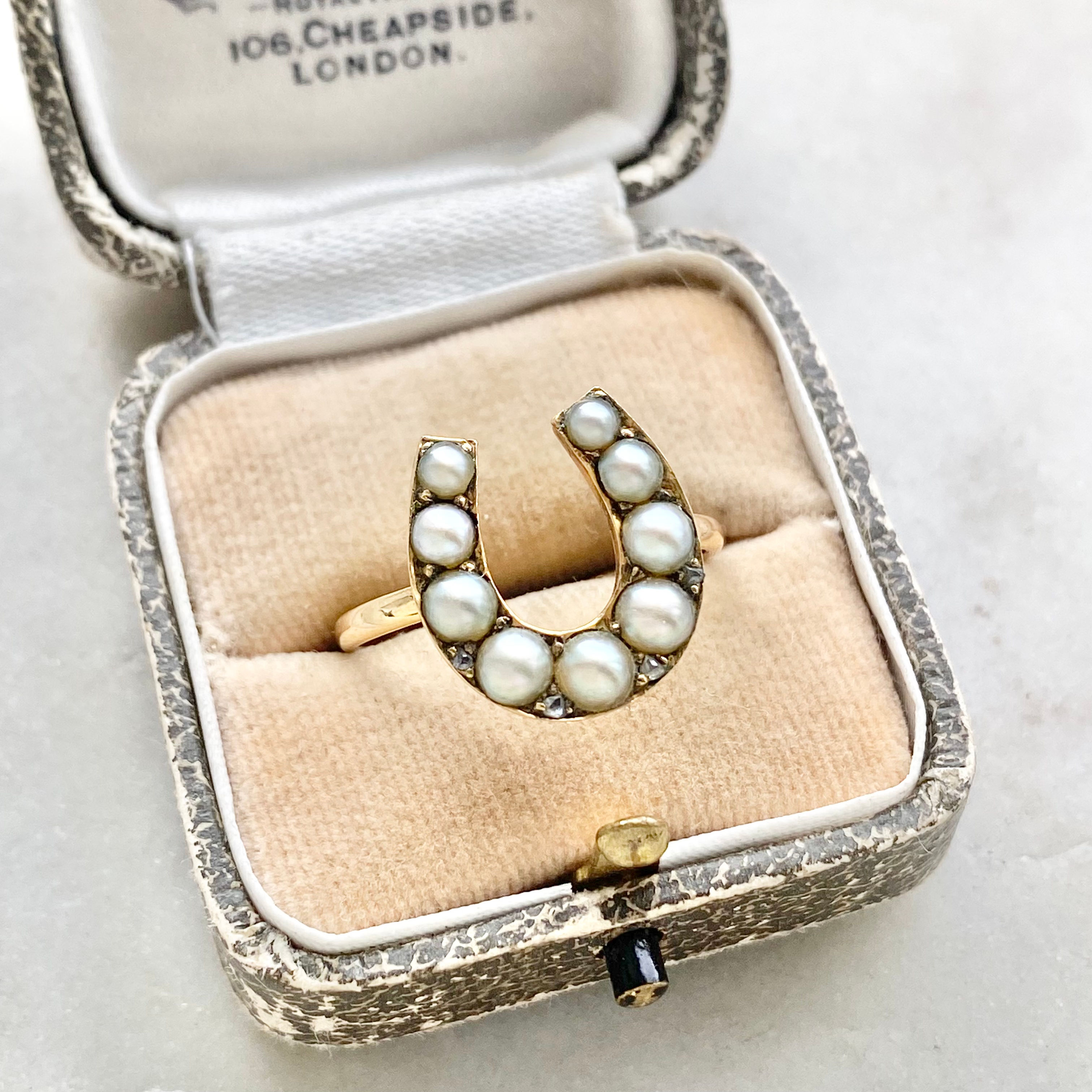 Antique 15ct gold pearl and diamond horseshoe ring