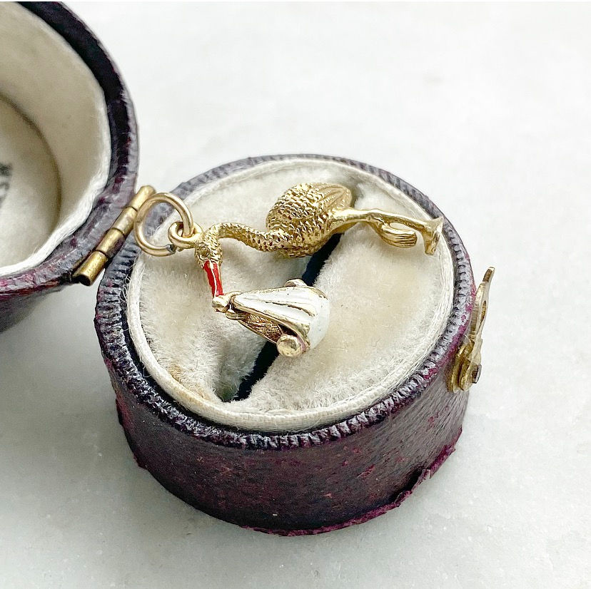 Thumbnail: Vintage 1962 9ct gold and enamel moving stork and baby charm