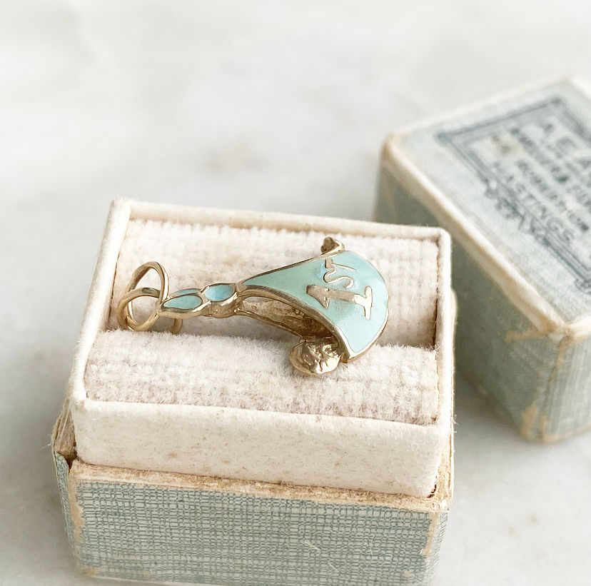 Thumbnail: Vintage 9ct gold and blue enamel first baby charm