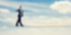 man with the blindfold walking on the rope over blue sky_edited_edited.jpg
