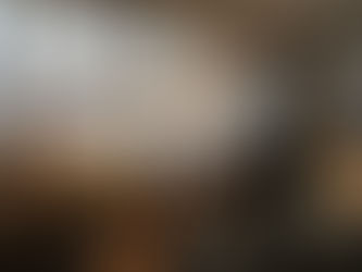 Naval architect reviewing blueprints in shipyard office