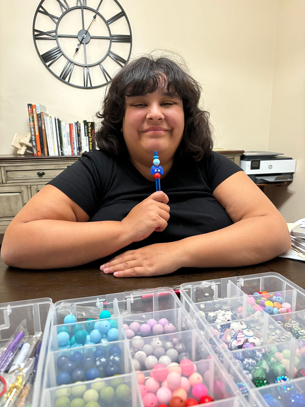Alyssa working on a pen
